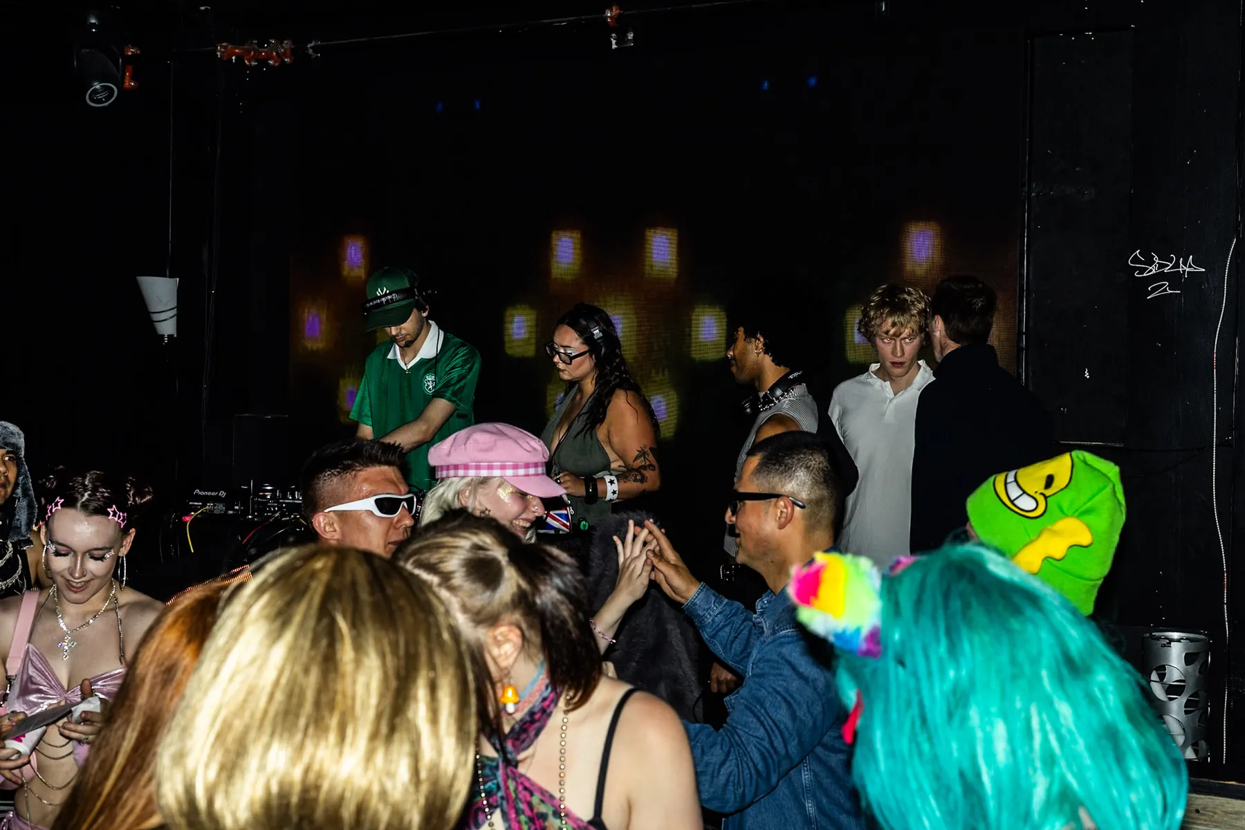 babyjah performing to a packed, colorful dance floor